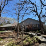 professional window cleaning in progress with equipment and staff ensuring spotless shine for commercial property in edmond ok