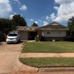 professional window cleaning service in progress with equipment and staff ensuring spotless shine for commercial property in edmond ok